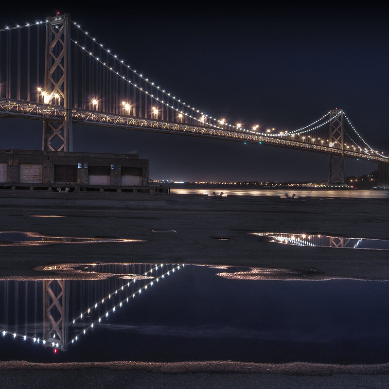 Bay Bridge at night with reflection