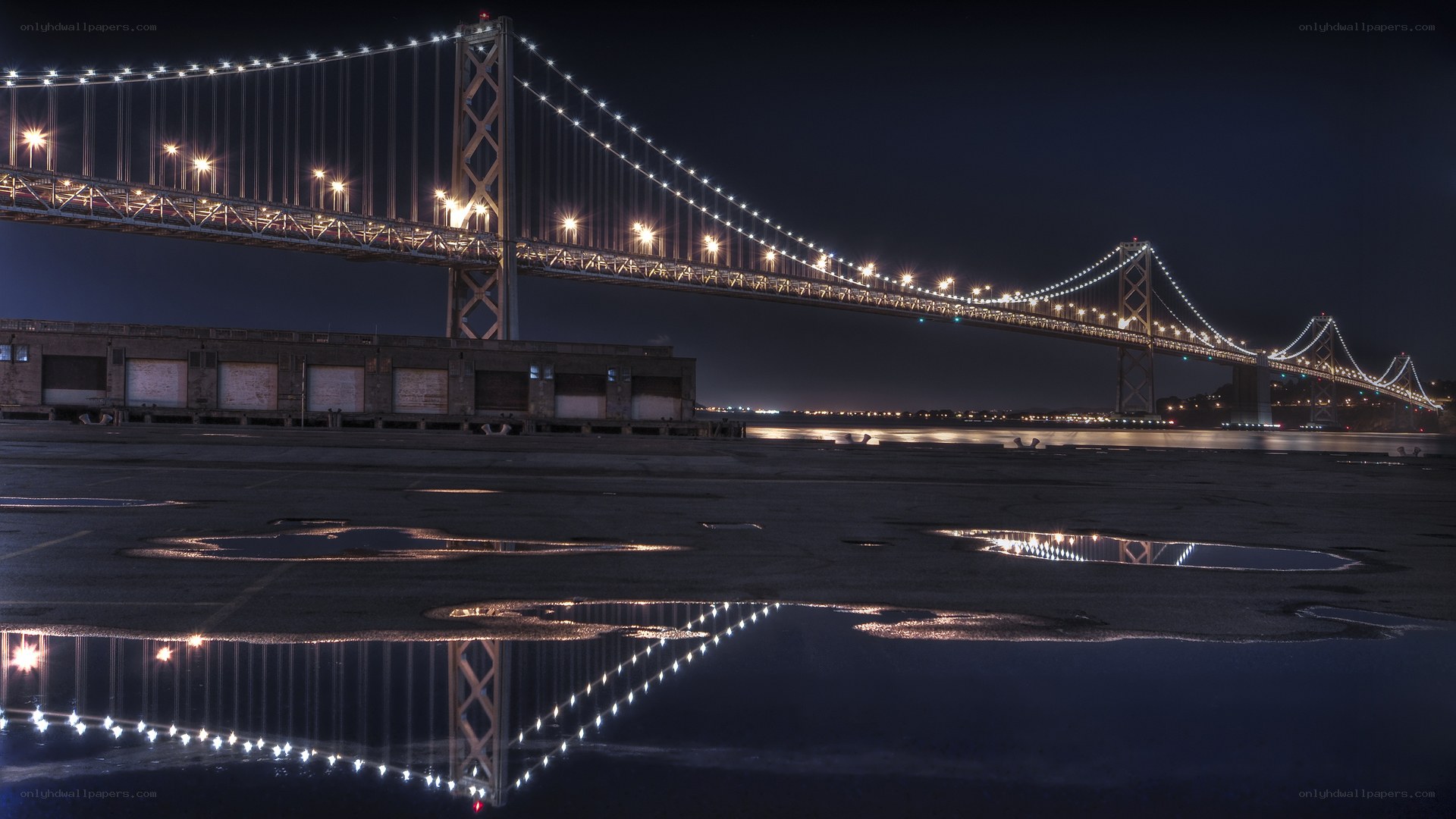 Bay Bridge at night with reflections