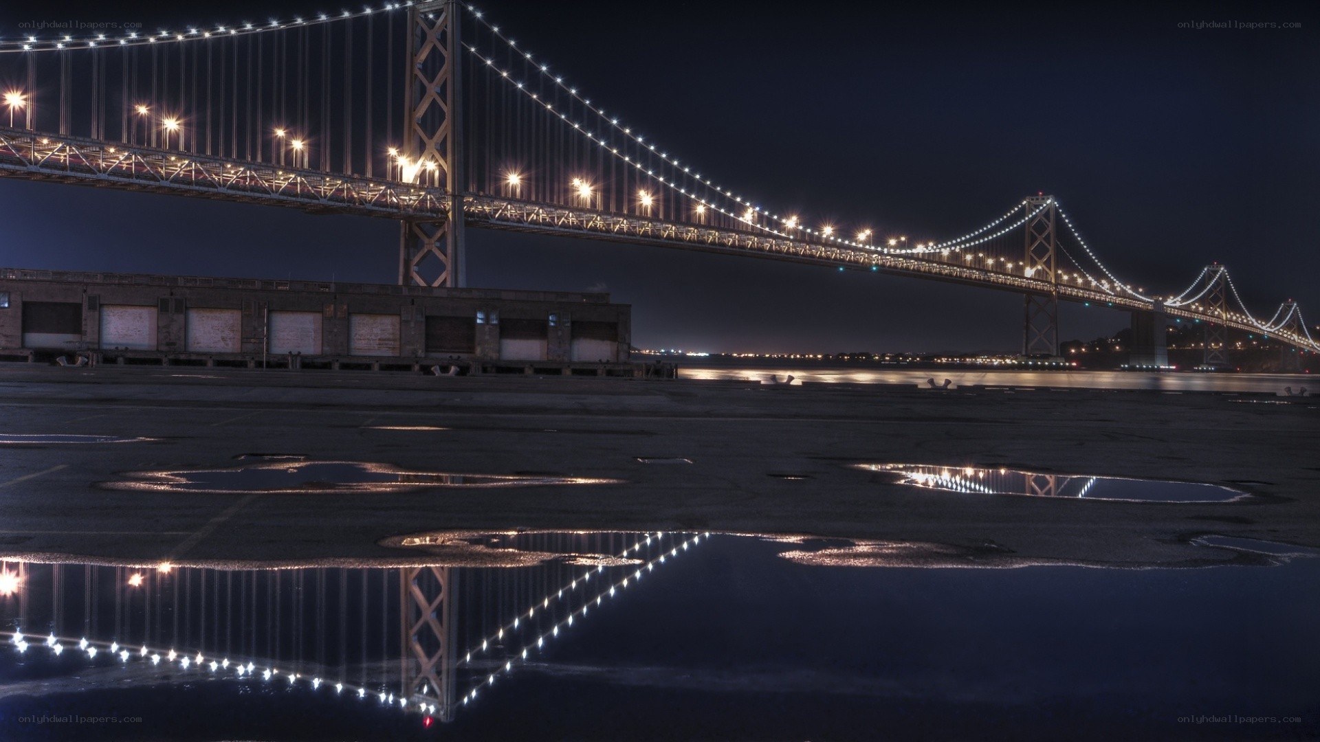 Bay Bridge at night with reflections