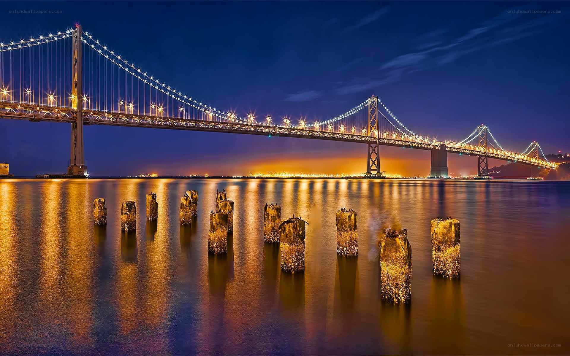 Bay Bridge at night with reflections