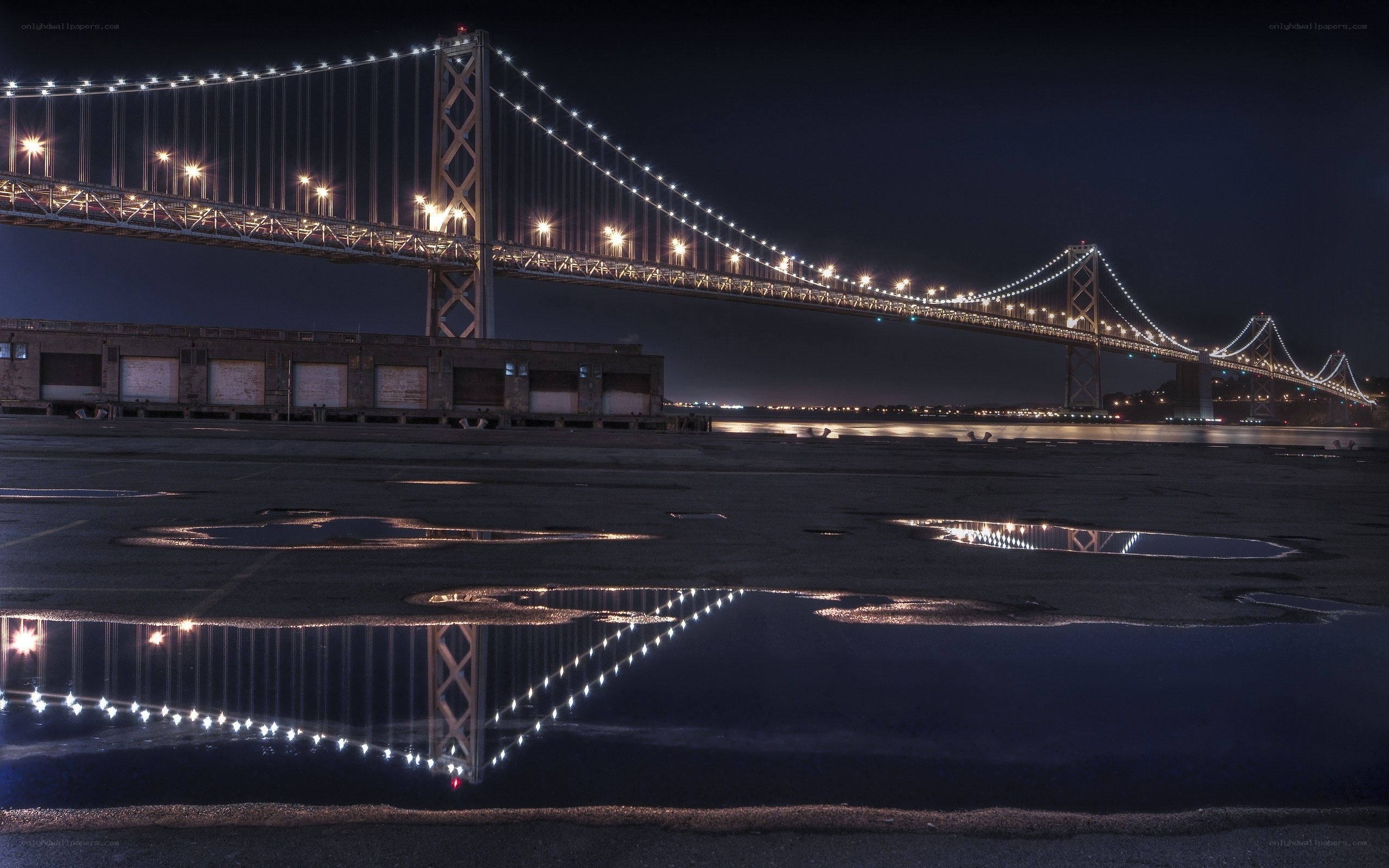 Bay Bridge at night with reflections