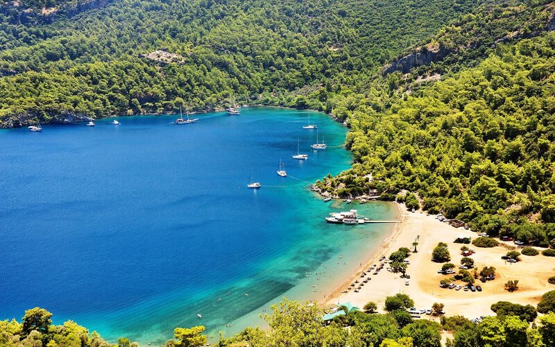 Bay with boats and beach