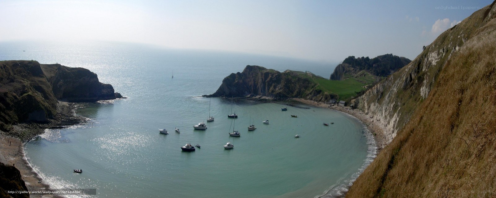 Bay with boats and cliffs