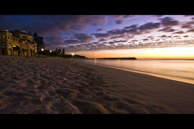 Beach at dawn with building