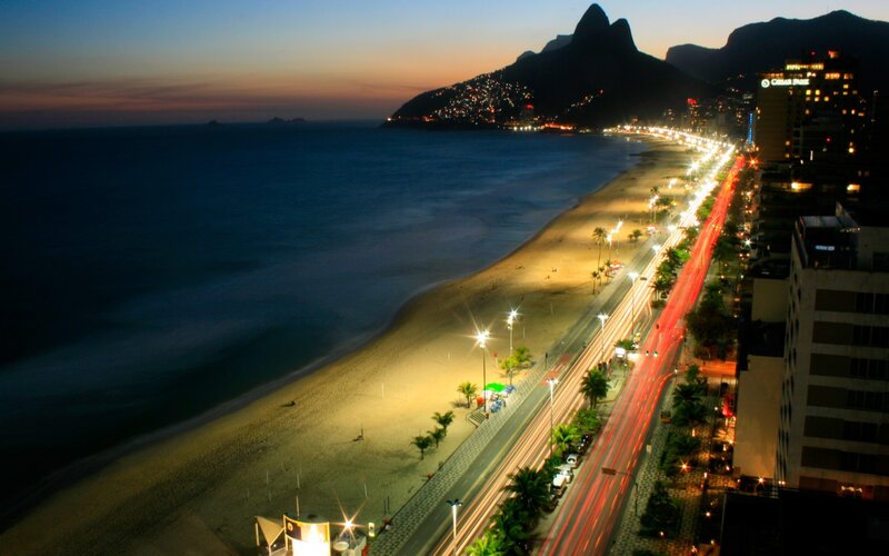 Beach at Dusk with City