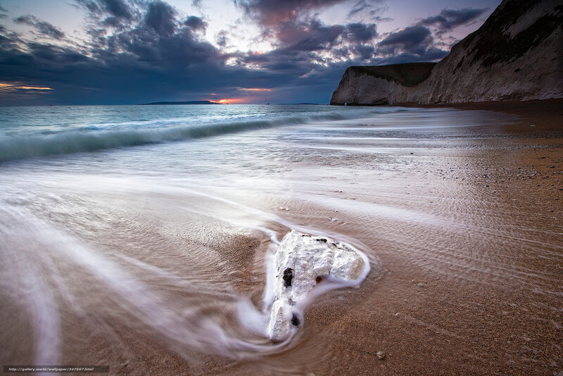 Beach at dusk with cliffs