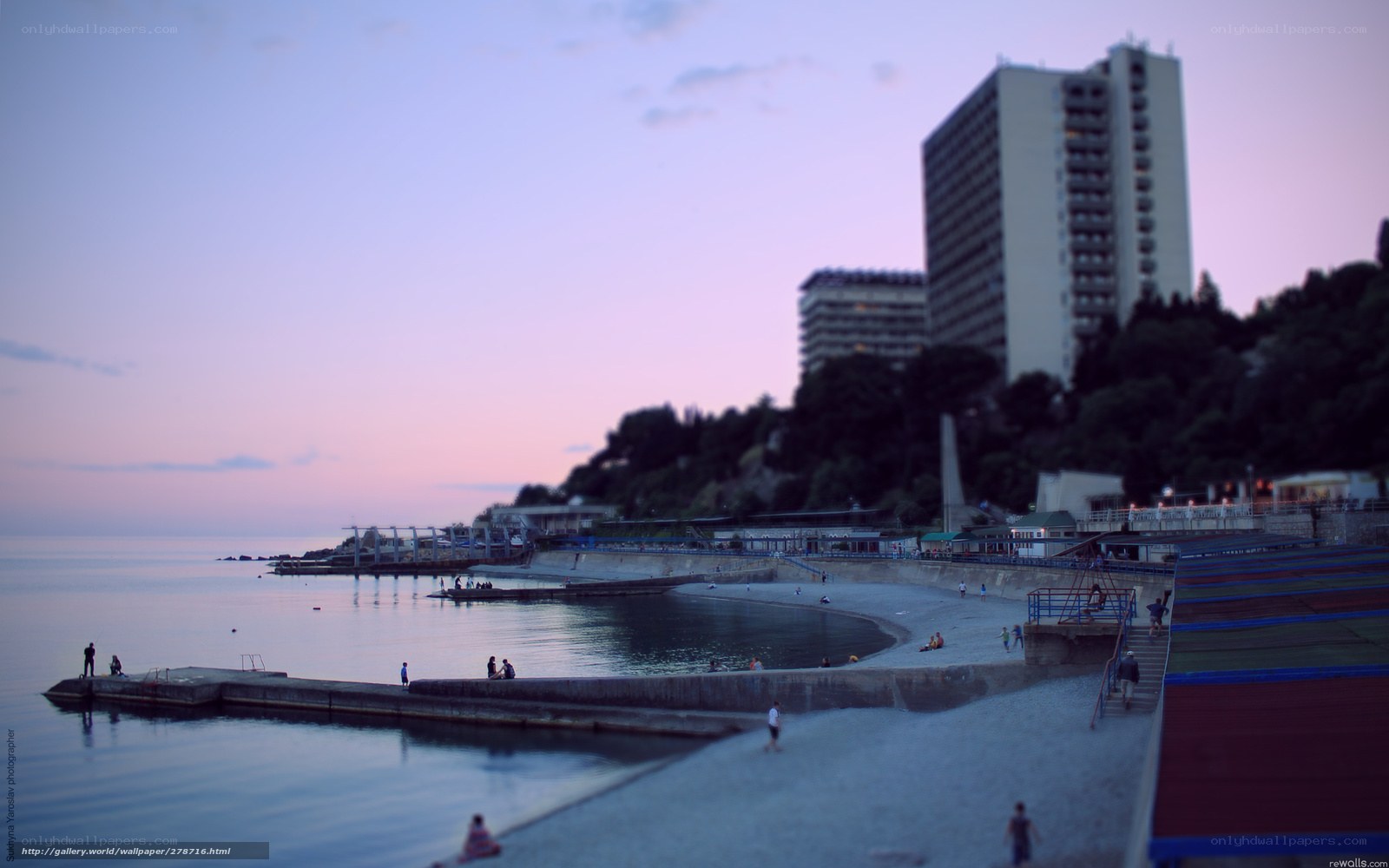 Beach at dusk with high-rise building
