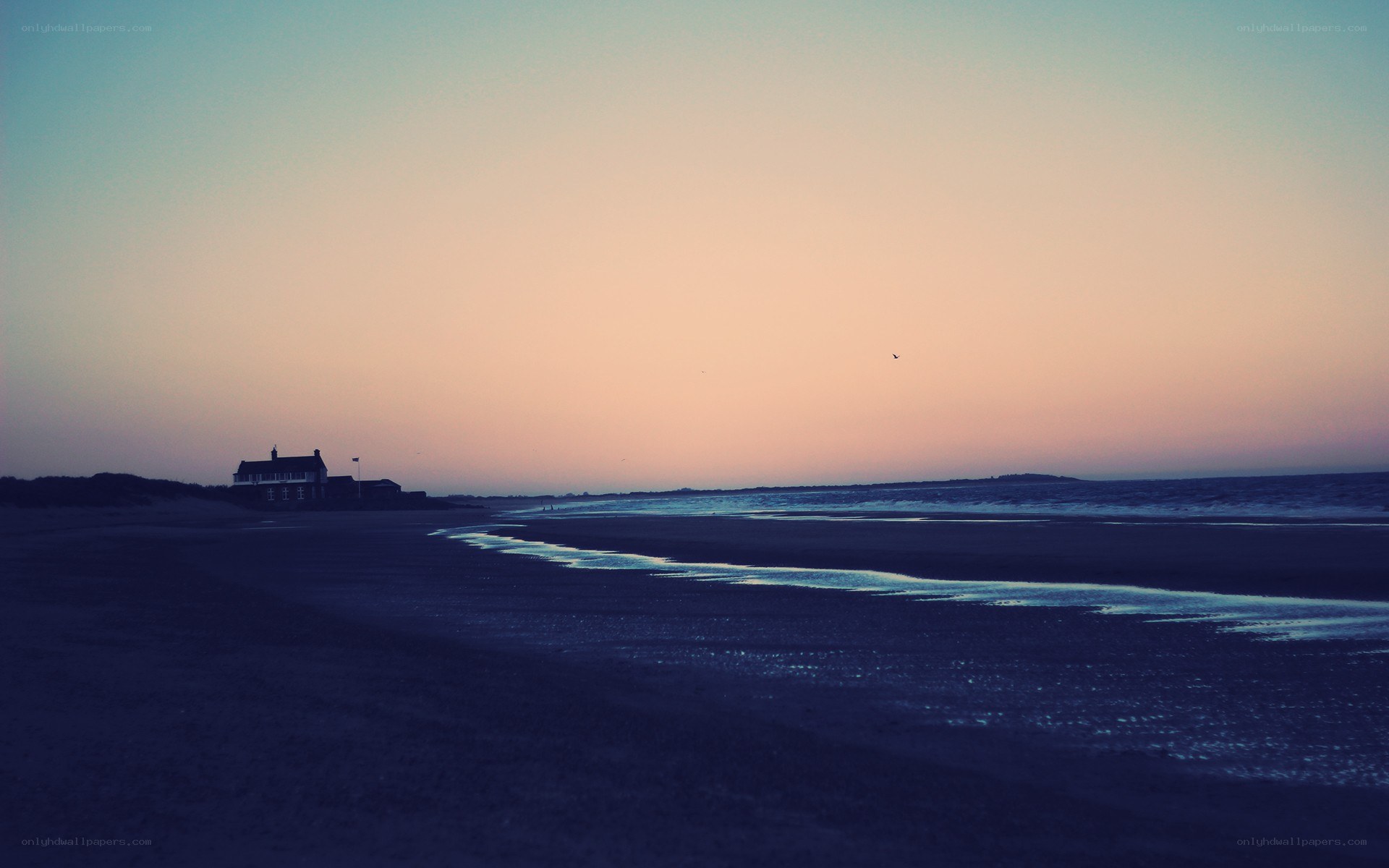 Beach at dusk with house