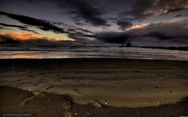 Beach at dusk with lighthouse