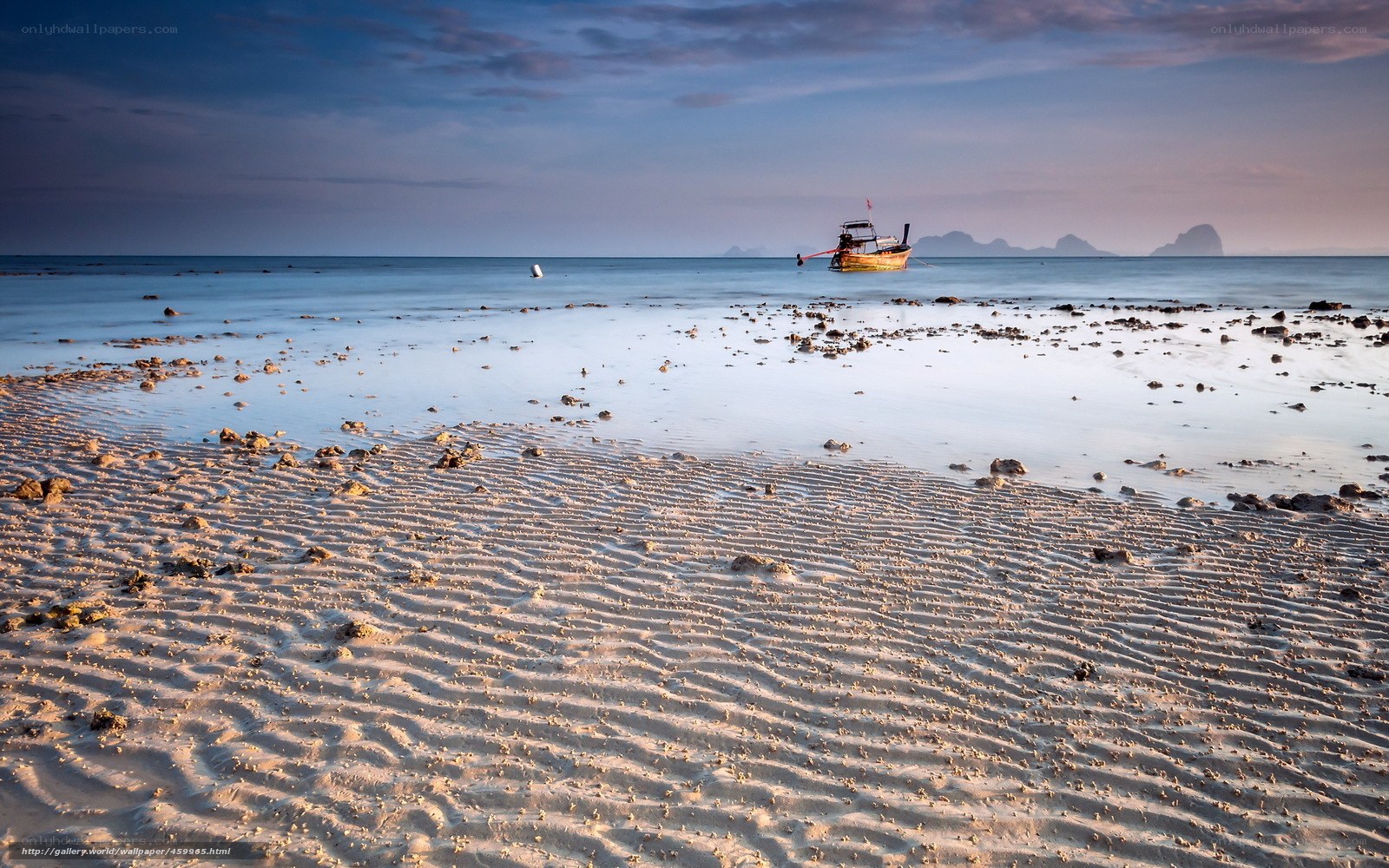 Beach at low tide with boat