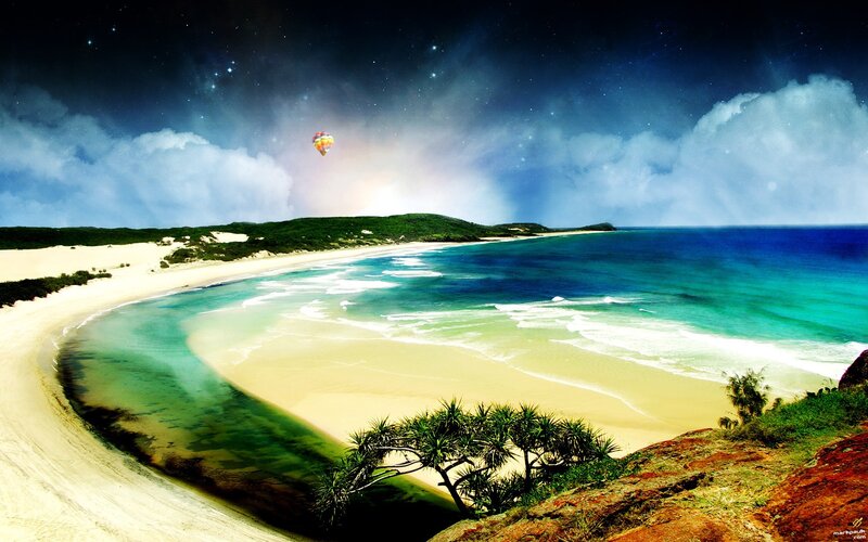 beach at night with hot air balloon