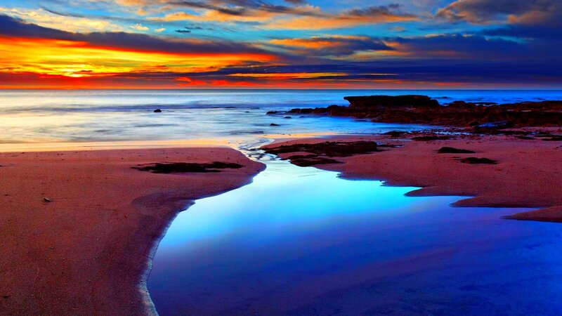 Beach at Sunset — Blue, Dramatic, Photograph, Ocean, Sky, Rocks, Orange, Red