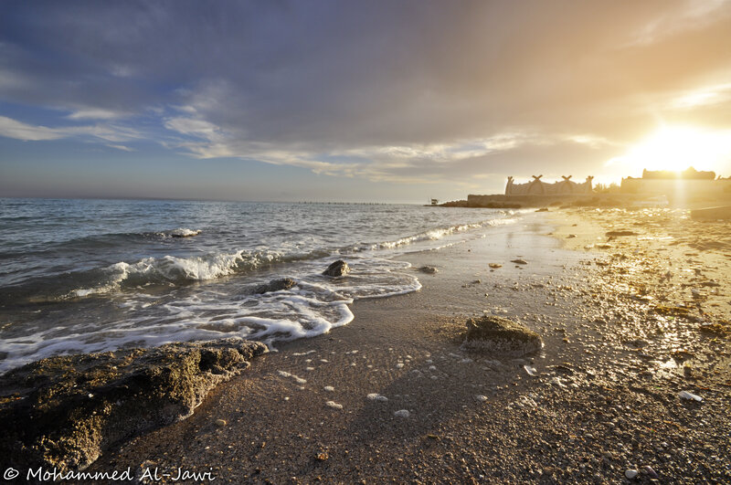 Beach at Sunset — Blue, Serene, Photograph, Ocean, Rocks, Building