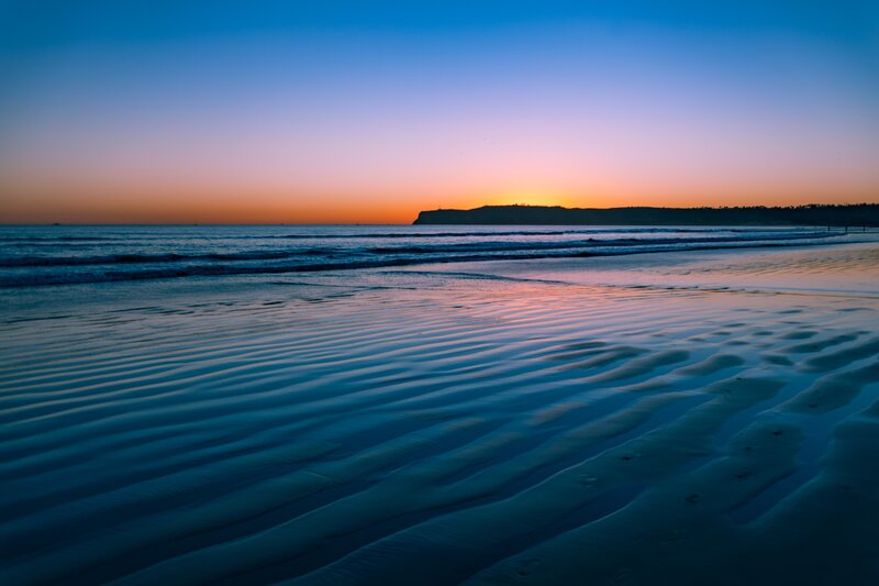Beach at Sunset — Blue, Serene, Photograph, Ocean, Sky, Cliff