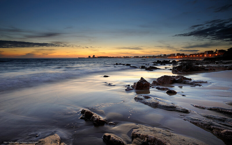 Beach at Sunset — Blue, Serene, Photograph, Rocks, City Skyline