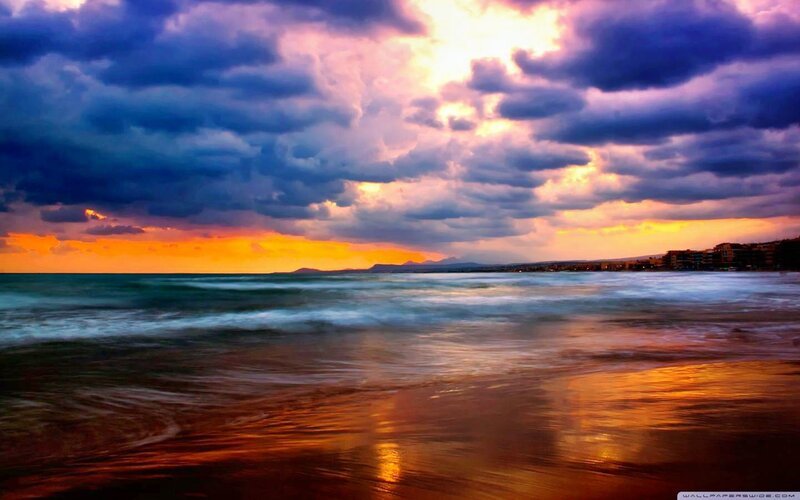 Beach at Sunset — Orange, Dramatic, Photograph, Ocean, Clouds, Buildings