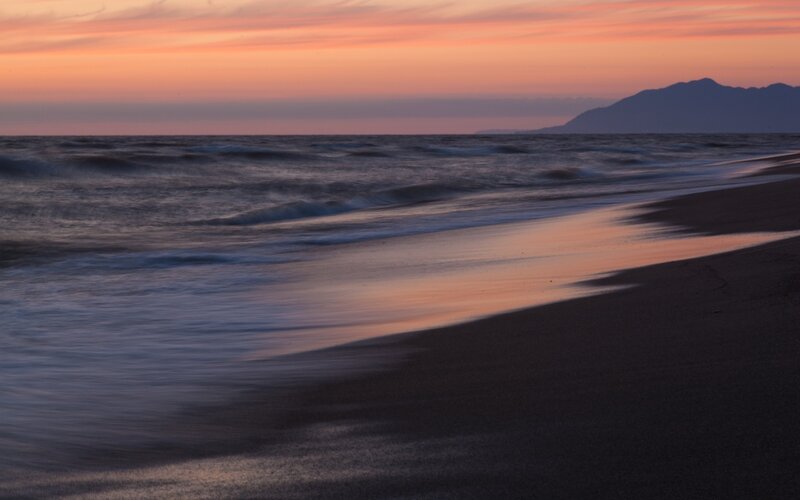 Beach at Sunset — Orange, Serene, Photograph, Ocean, Mountain, Sky