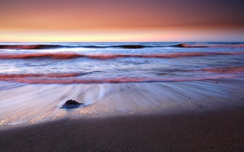 Beach at Sunset — Orange, Serene, Photograph, Ocean, Sand, Rock, Purple