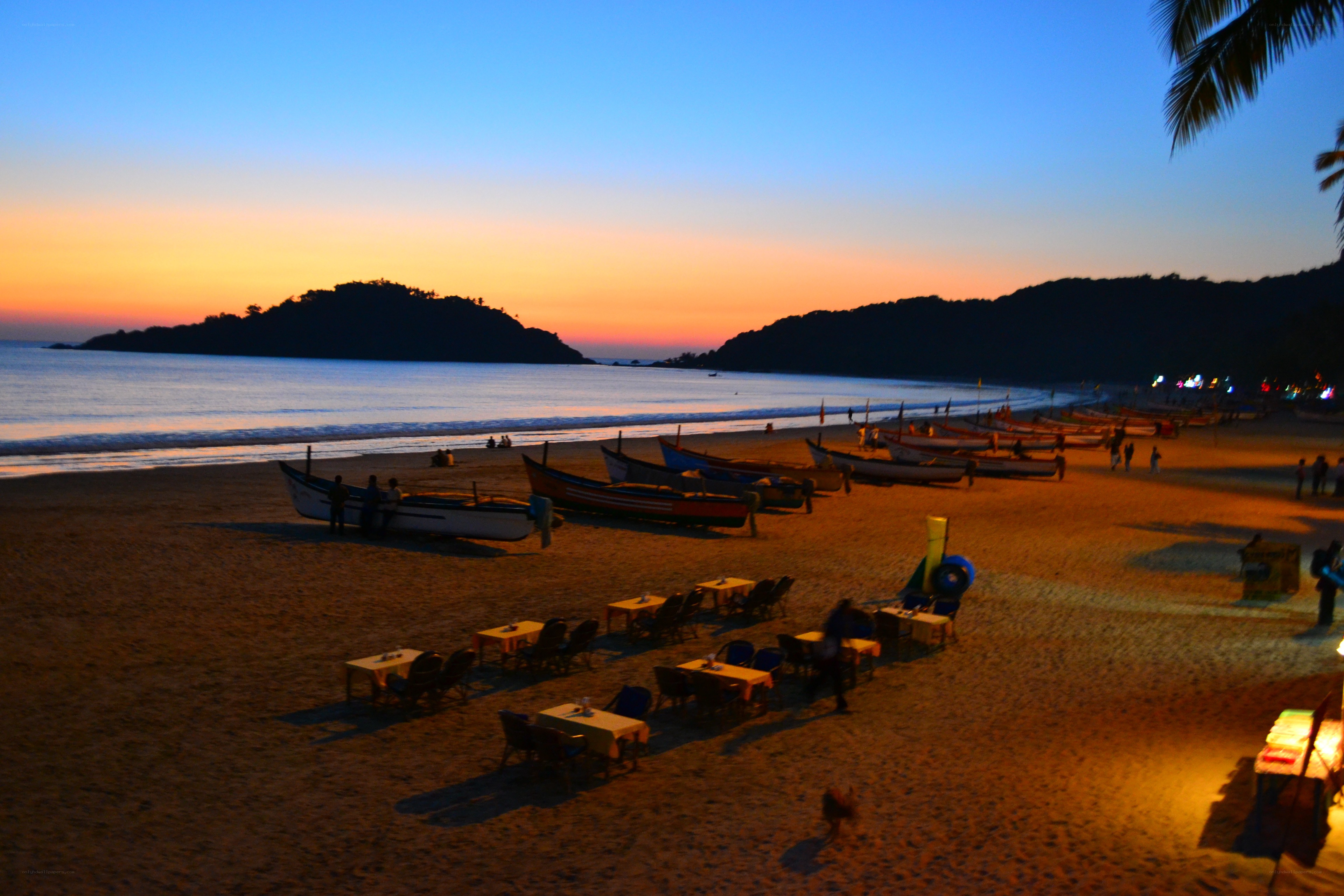 Beach at sunset with boats
