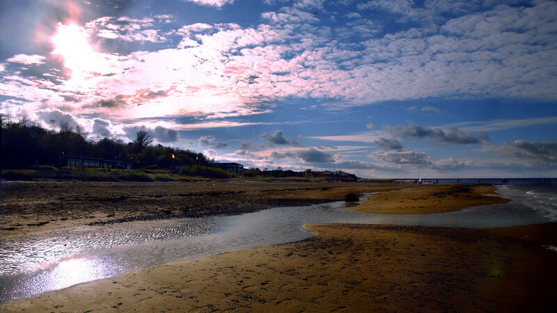 Beach at sunset with clouds