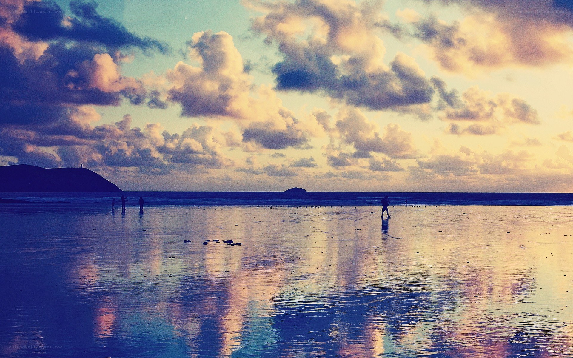 Beach at sunset with clouds
