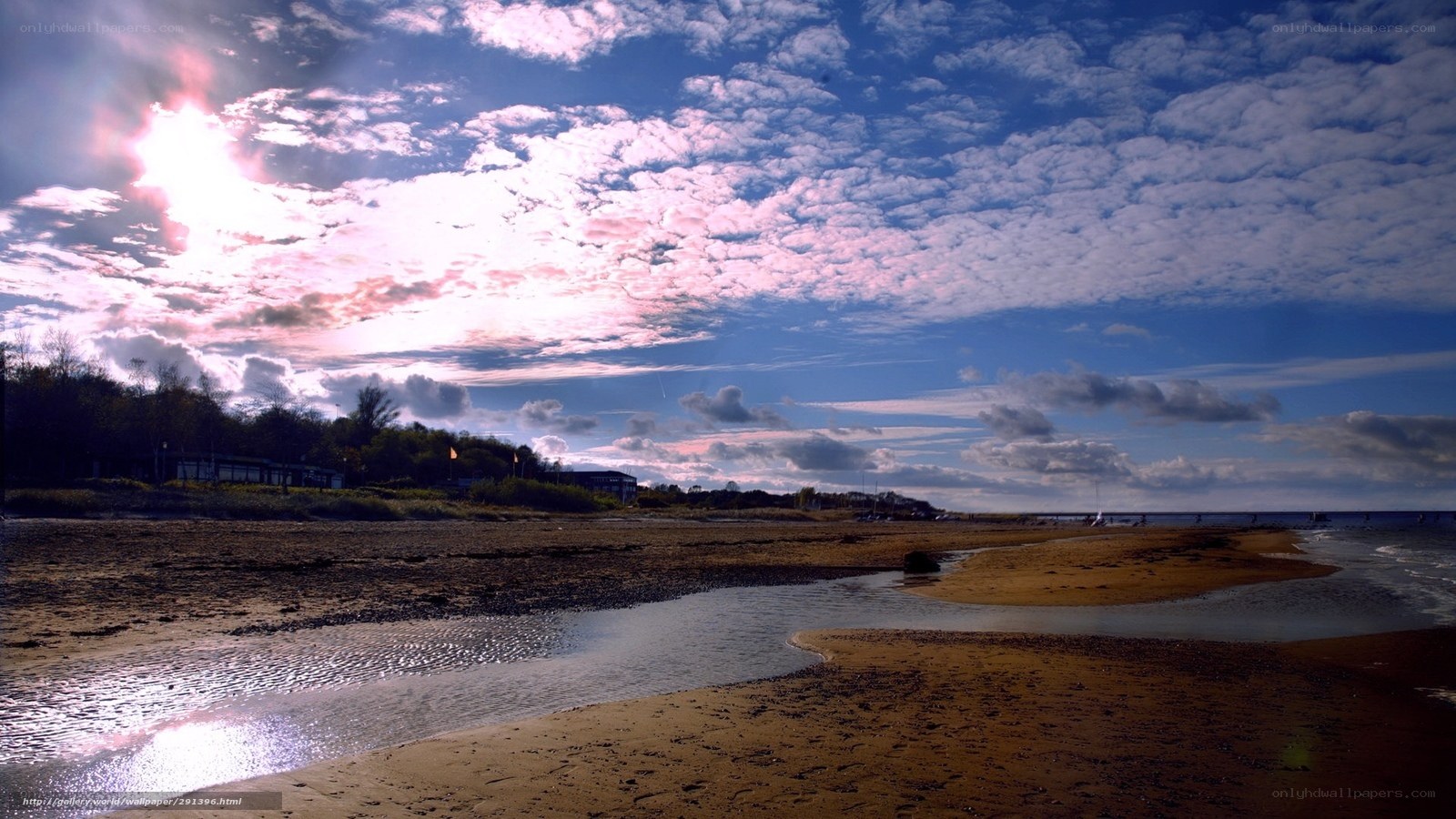 Beach at sunset with clouds