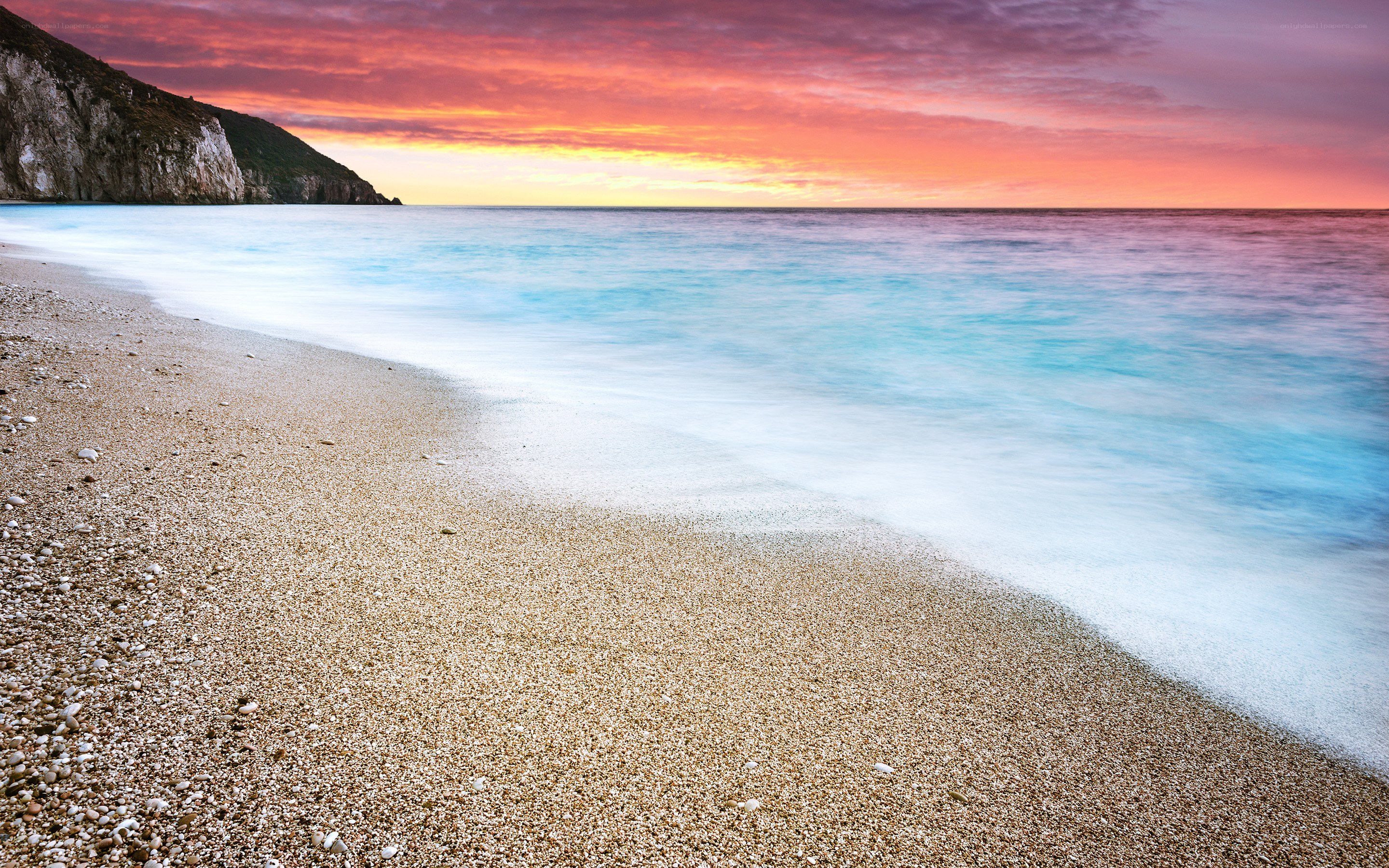 Beach at sunset with colorful sky