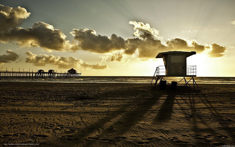 Beach at sunset with lifeguard tower