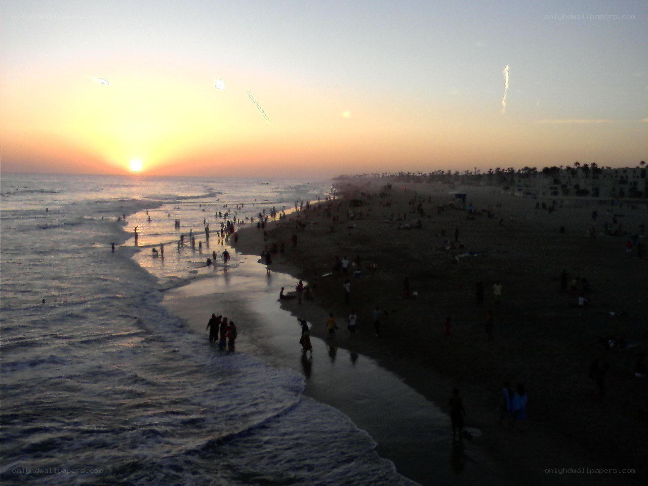 beach at sunset with people