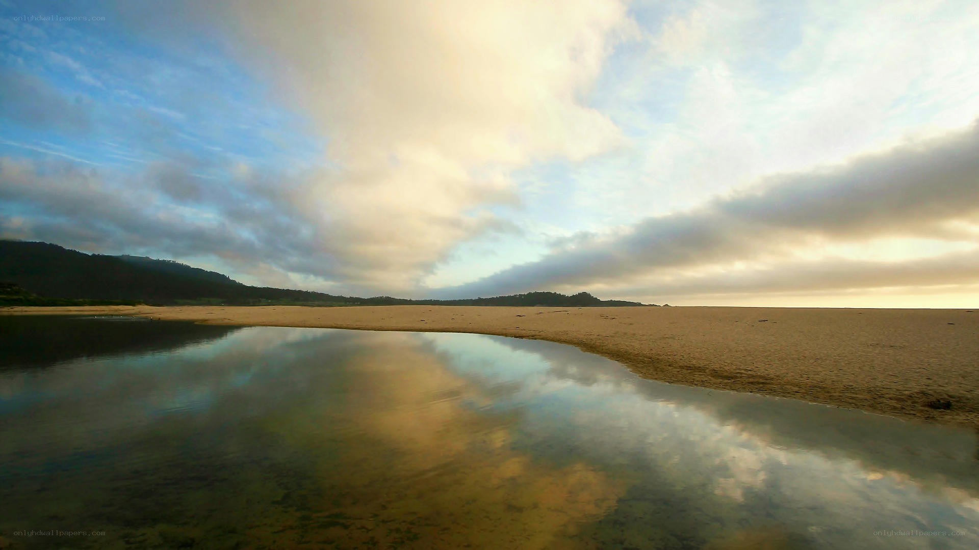 beach at sunset with reflection