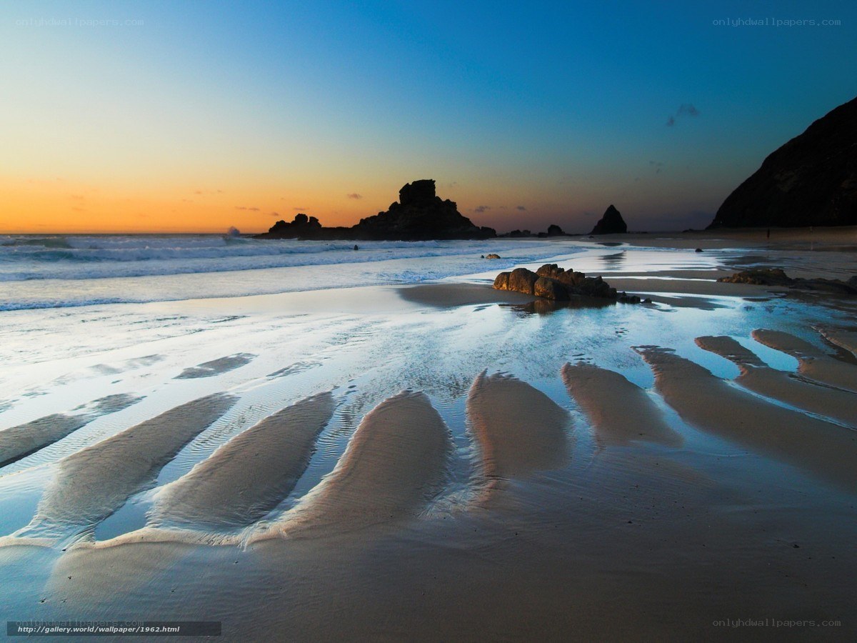 Beach at sunset with rock formations