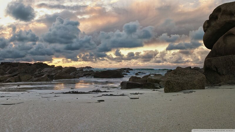 Beach at sunset with rocks
