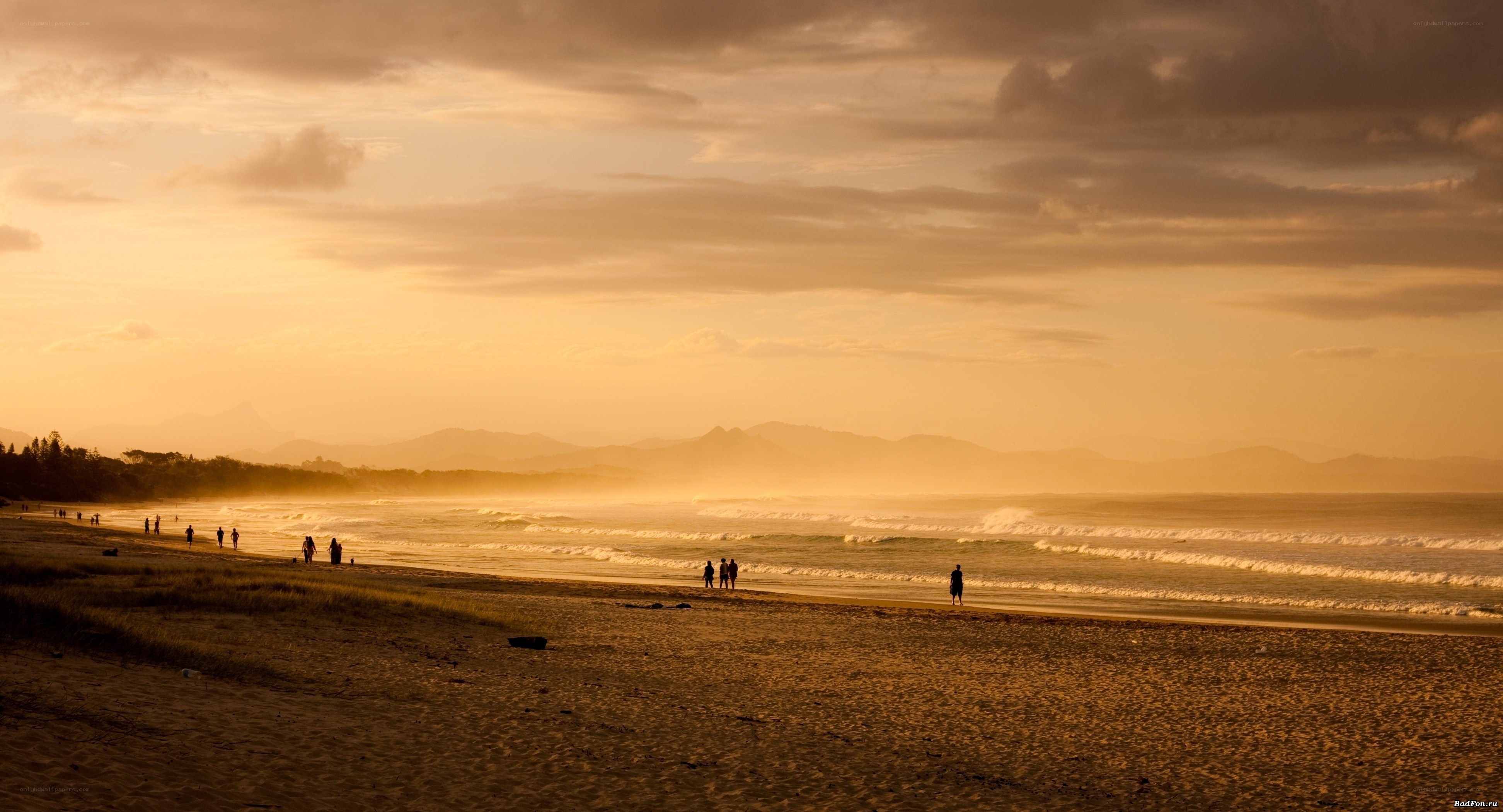 beach at sunset with silhouettes