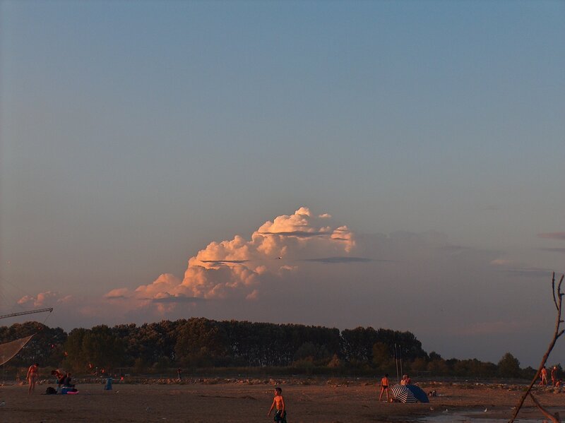 Beach at sunset with storm cloud