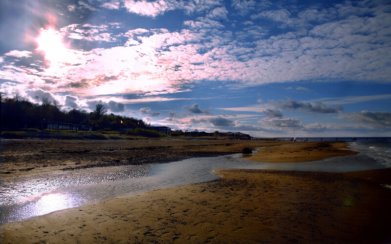 Beach at sunset with stream