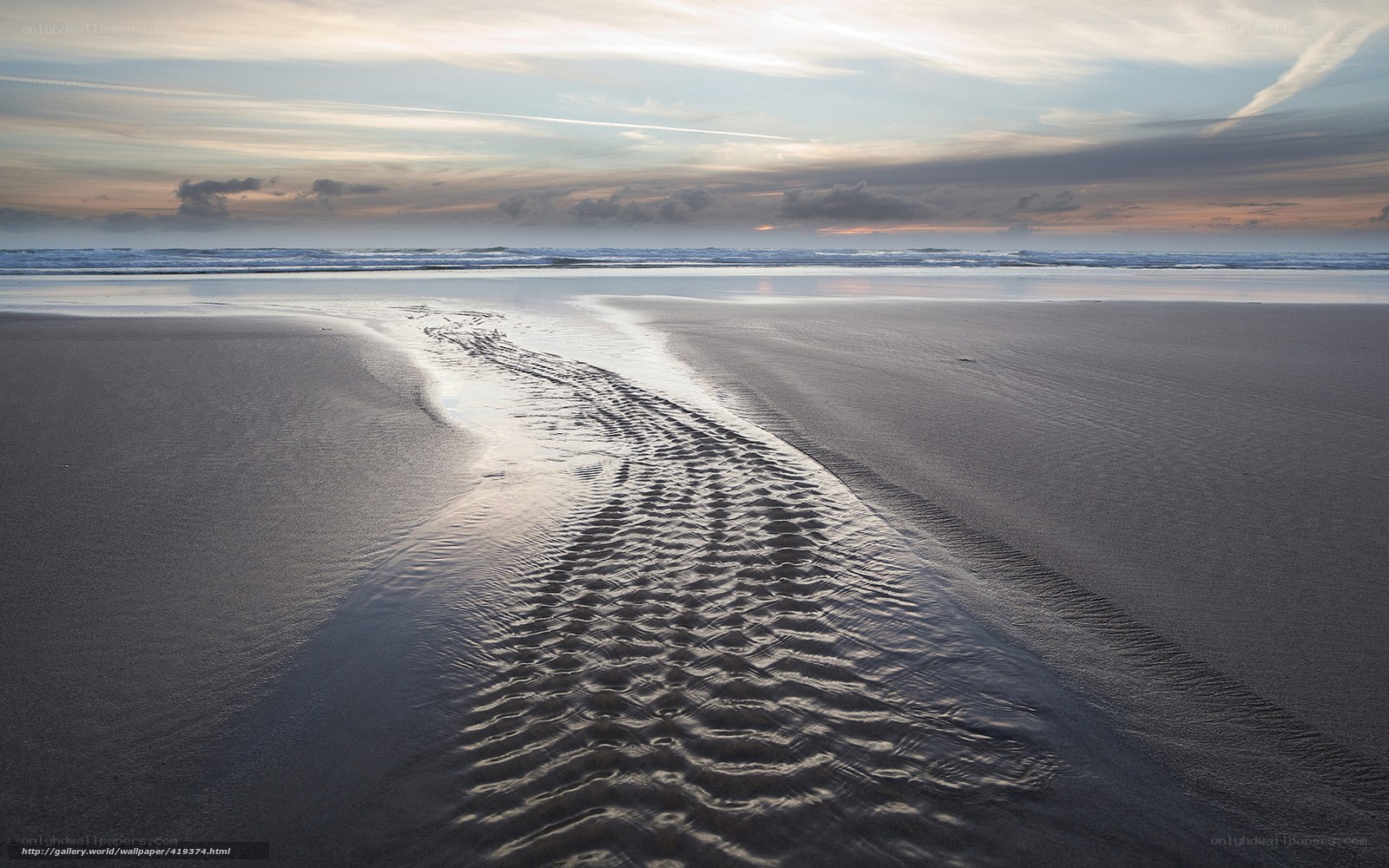 beach at sunset with tide lines