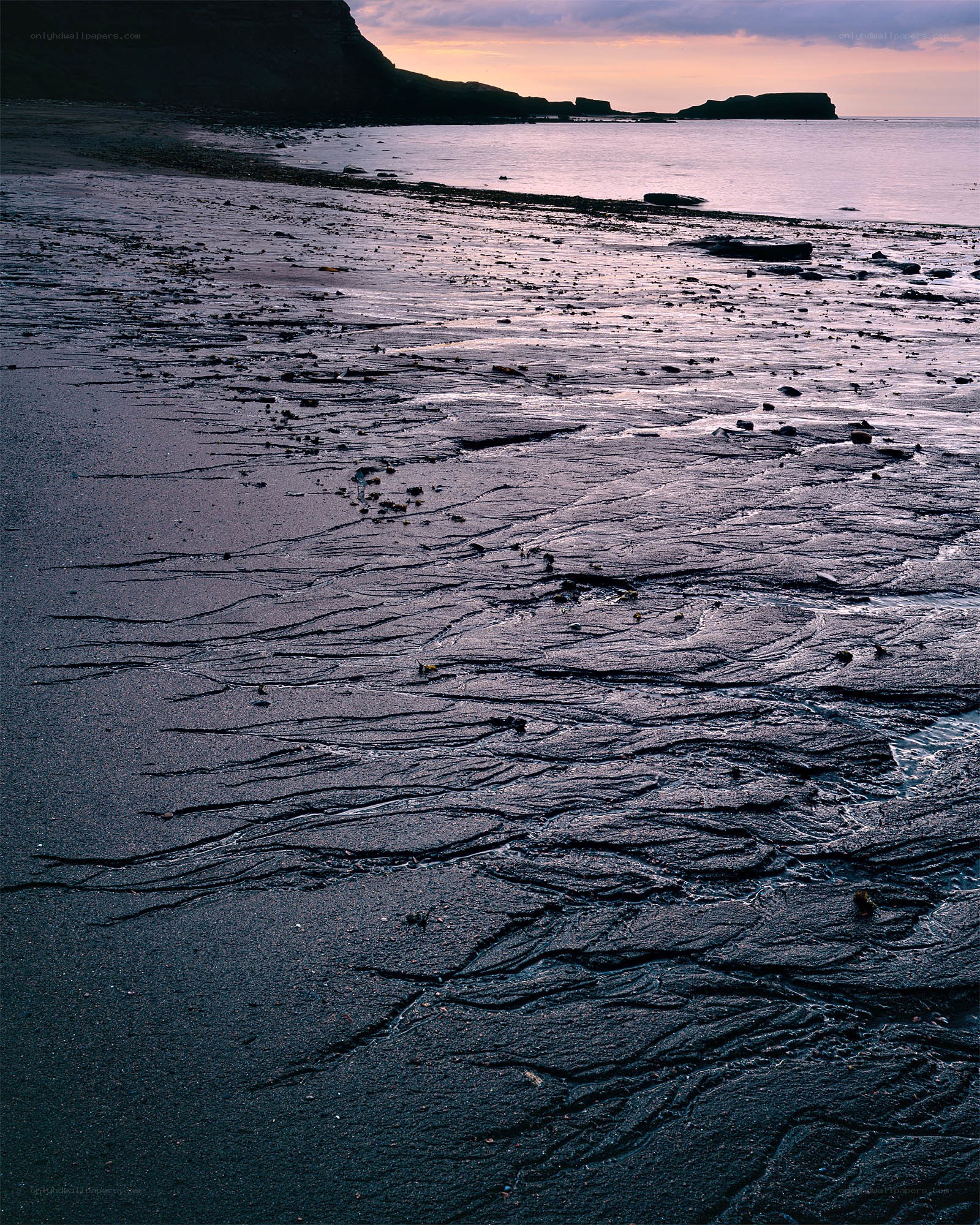 beach at sunset with tide pools