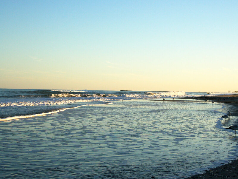beach at sunset with waves