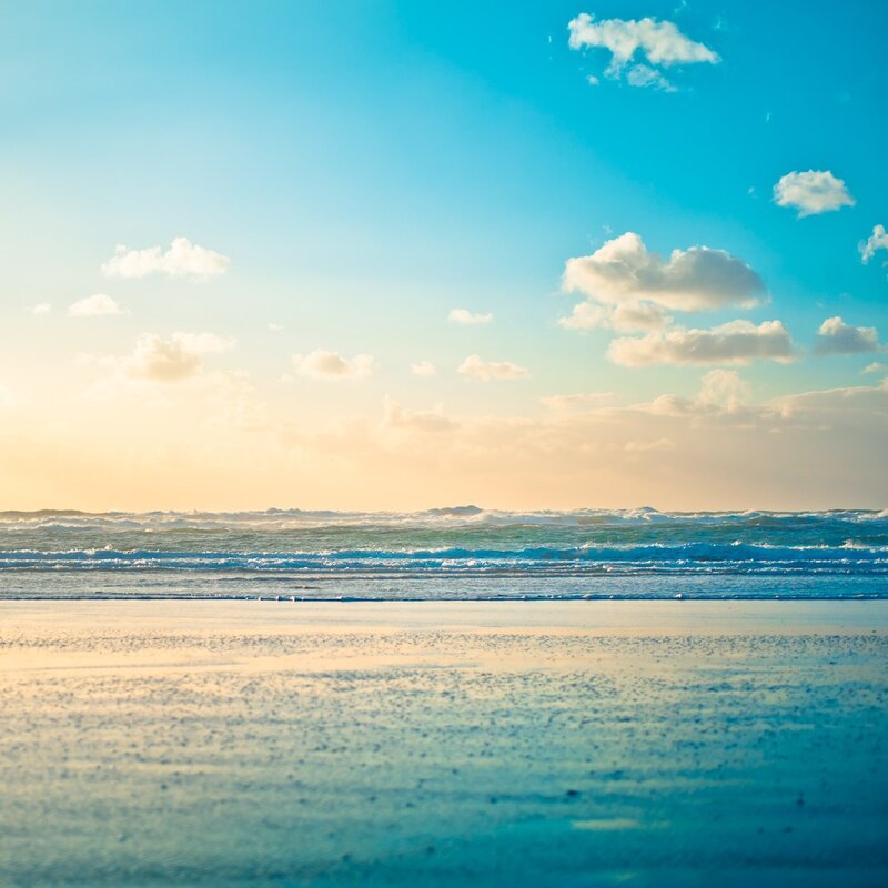 beach at sunset with waves