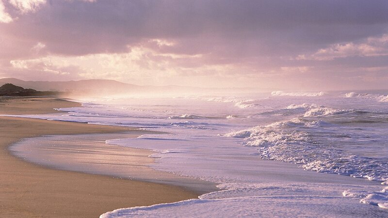 beach at sunset with waves
