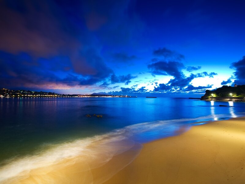 Beach at Twilight — Blue, Serene, Night, Photograph, Ocean, Sky, Lights, Yellow