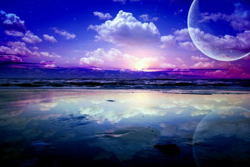 Beach at twilight with a large moon