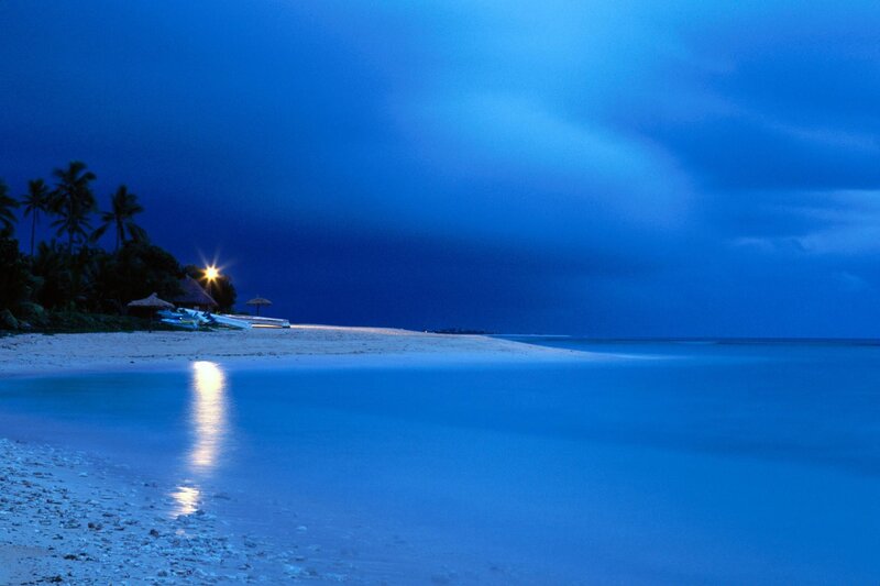 Beach at twilight with lights
