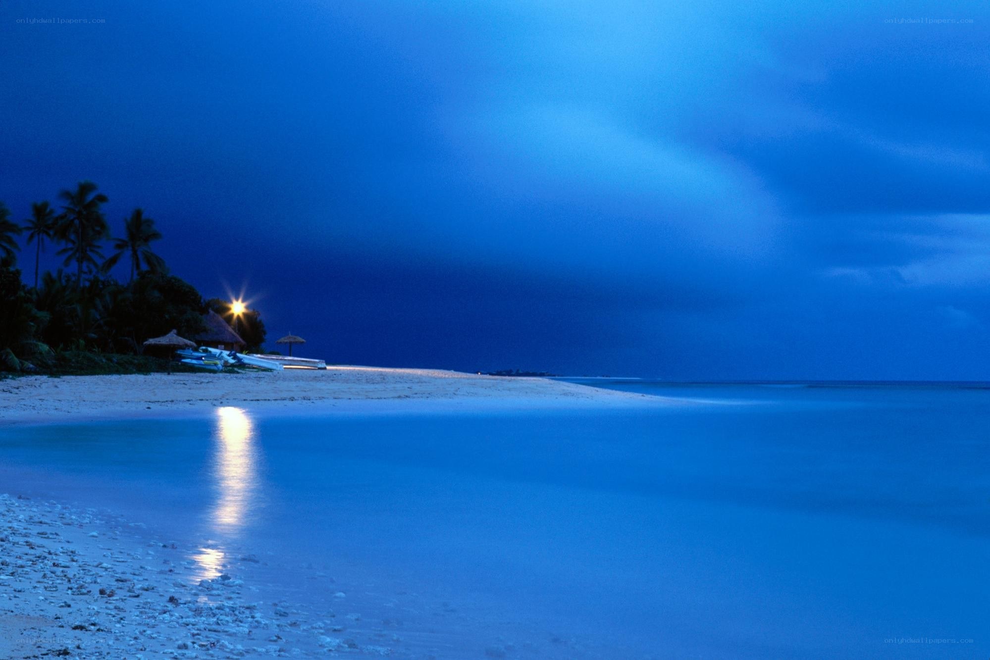 Beach at twilight with lights