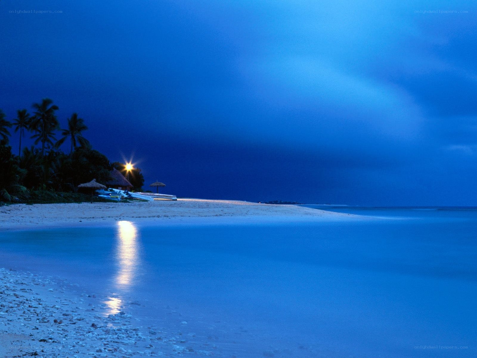 Beach at twilight with lights