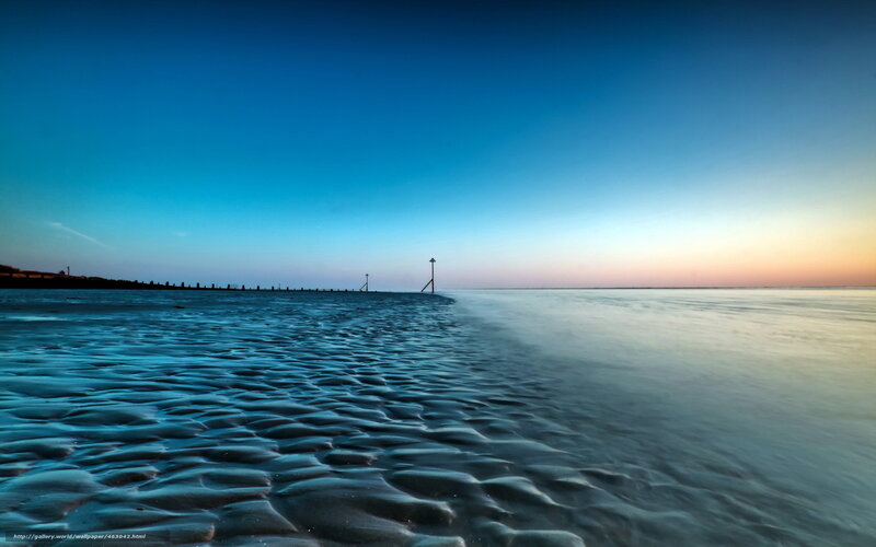 Beach at twilight with rippled sand