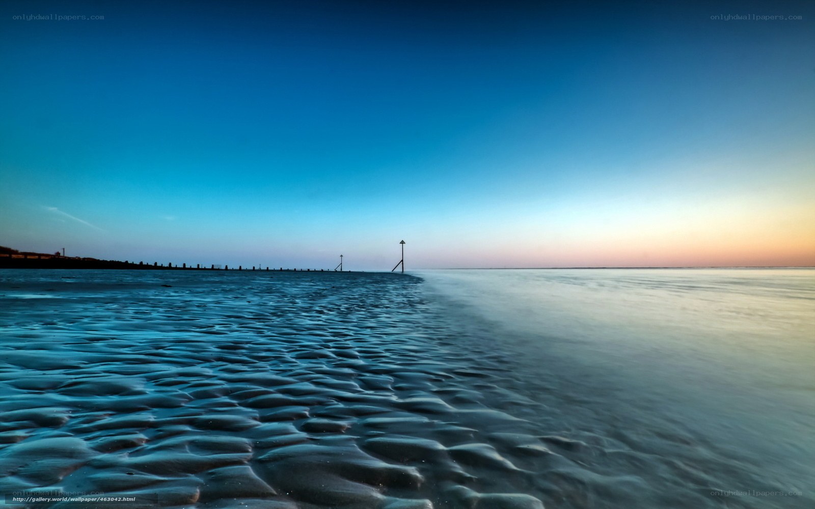 Beach at twilight with rippled sand