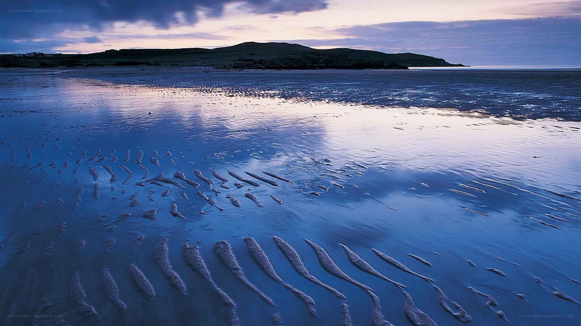 beach at twilight with sand ripples