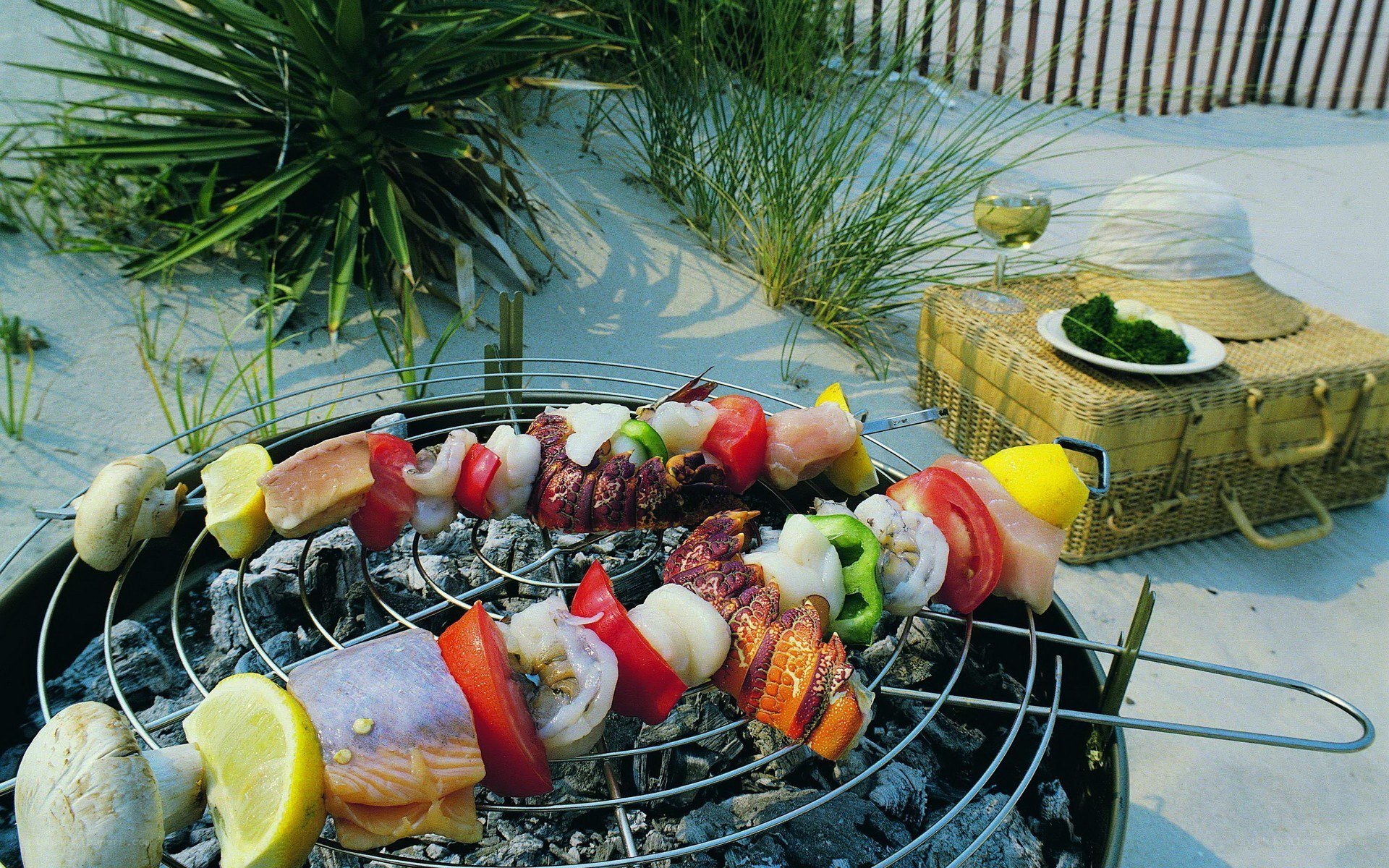 Beach barbecue with skewers