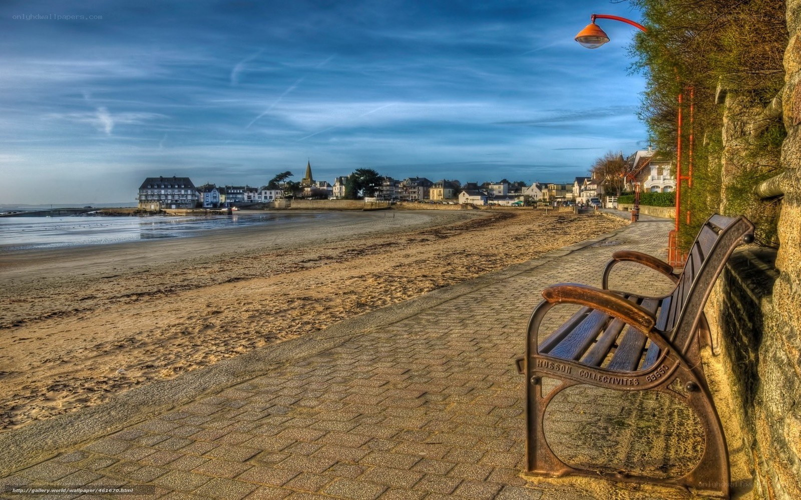 Beach bench overlooking coastal town
